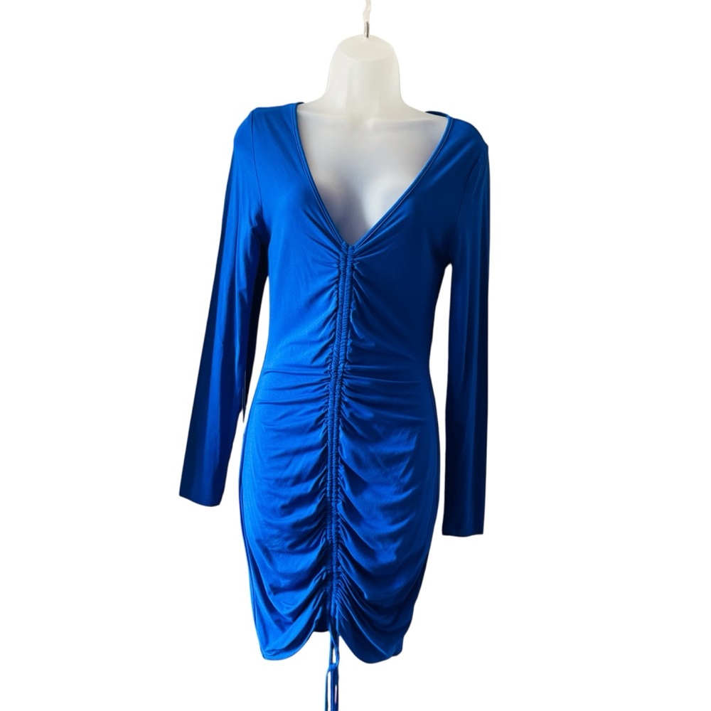Bodycon dress with surplice collar, side drawstring, fitted long sleeves.